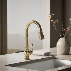 Pull-down kitchen sink faucet with three-function sprayhead^Kohler