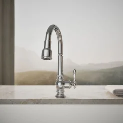 Pull-down kitchen sink faucet with three-function sprayhead^Kohler