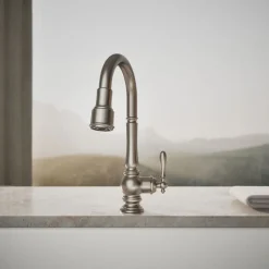 Pull-down kitchen sink faucet with three-function sprayhead^Kohler