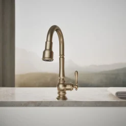 Pull-down kitchen sink faucet with three-function sprayhead^Kohler