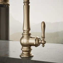 Pull-down kitchen sink faucet with three-function sprayhead^Kohler