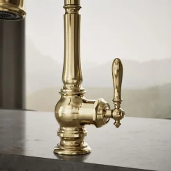 Pull-down kitchen sink faucet with three-function sprayhead^Kohler
