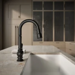 Pull-down kitchen sink faucet with three-function sprayhead^Kohler