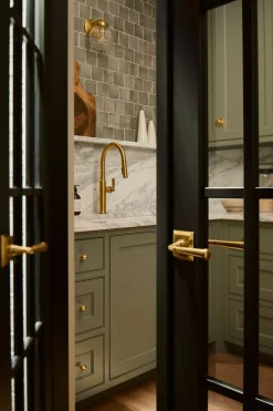 Pull-down kitchen sink faucet with three-function sprayhead^Kohler