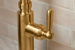 Pull-down kitchen sink faucet with three-function sprayhead^Kohler