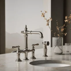 Three-hole bridge bar sink faucet with side sprayer^Kohler Outlet