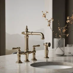 Three-hole bridge bar sink faucet with side sprayer^Kohler Outlet