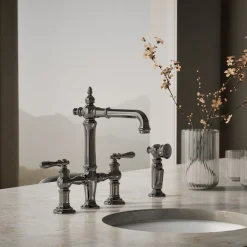 Three-hole bridge bar sink faucet with side sprayer^Kohler Outlet