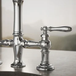 Three-hole bridge bar sink faucet with side sprayer^Kohler Outlet
