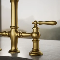 Three-hole bridge bar sink faucet with side sprayer^Kohler Outlet