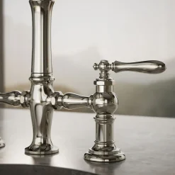 Three-hole bridge bar sink faucet with side sprayer^Kohler Outlet