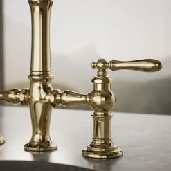 Three-hole bridge bar sink faucet with side sprayer^Kohler Outlet