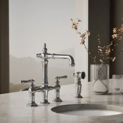 Three-hole bridge bar sink faucet with side sprayer^Kohler Outlet