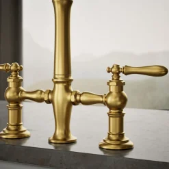 Three-hole bridge kitchen sink faucet with side sprayer^Kohler Outlet