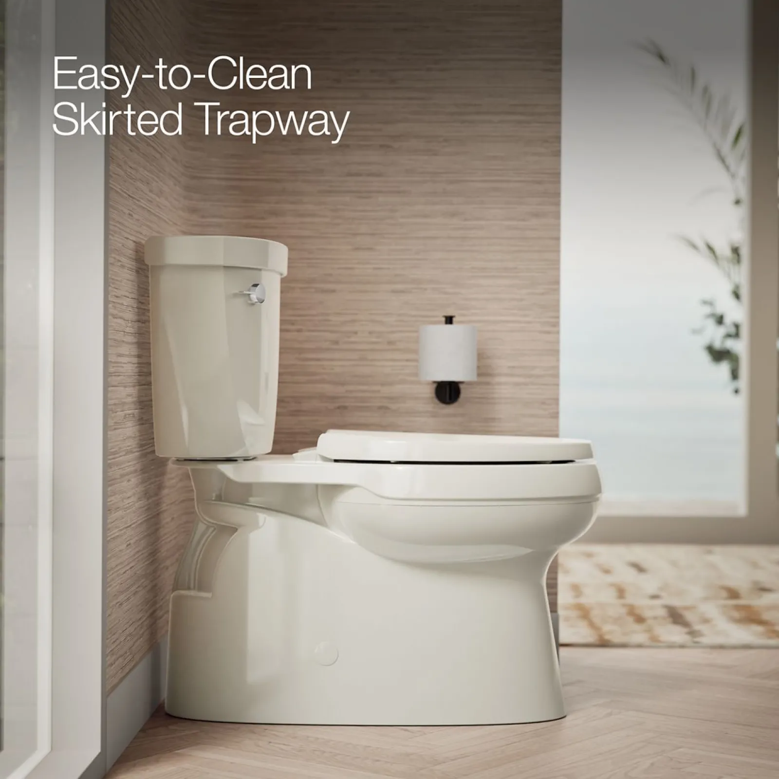 Two-piece elongated toilet with skirted trapway, 1.28 gpf^Kohler