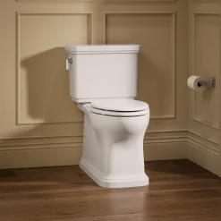 Two-piece elongated toilet with skirted trapway, 1.28 gpf^Kohler Best