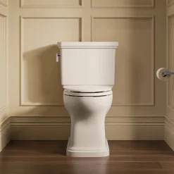 Two-piece elongated toilet with skirted trapway, 1.28 gpf^Kohler Best